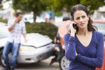 Driver Making a Phone Call After a car Accident