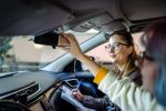 Teenager girl having driving lesson to follow car safety tips